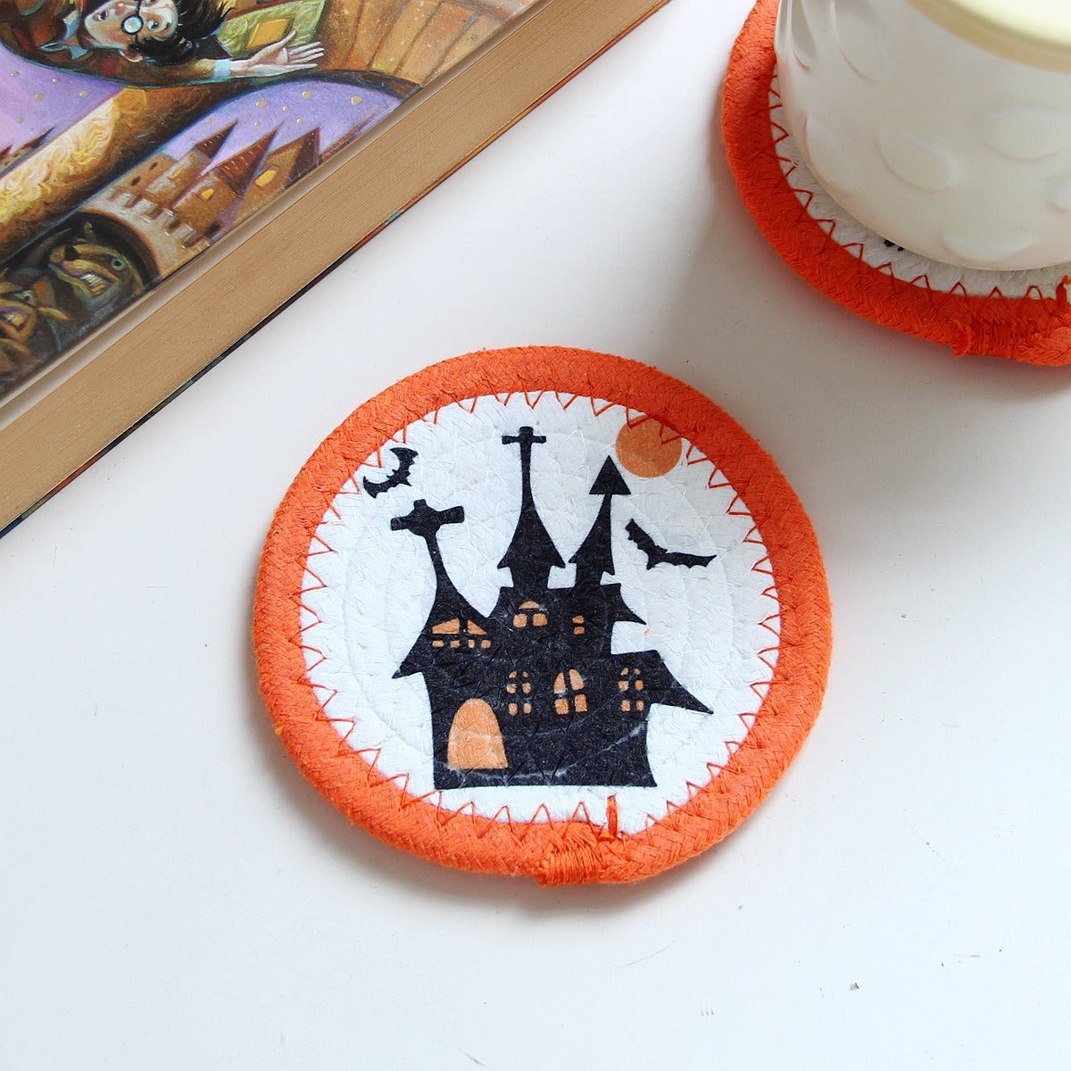 Cotton rope coaster with a haunted house design