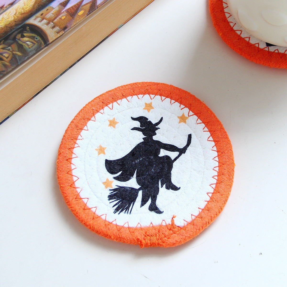 Cotton rope coaster with a witch on a broomstick design